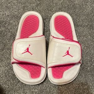 pink and white jordan slides